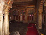 Warm, inviting interior of suffra with royal gold accents and traditional Arabic decor.