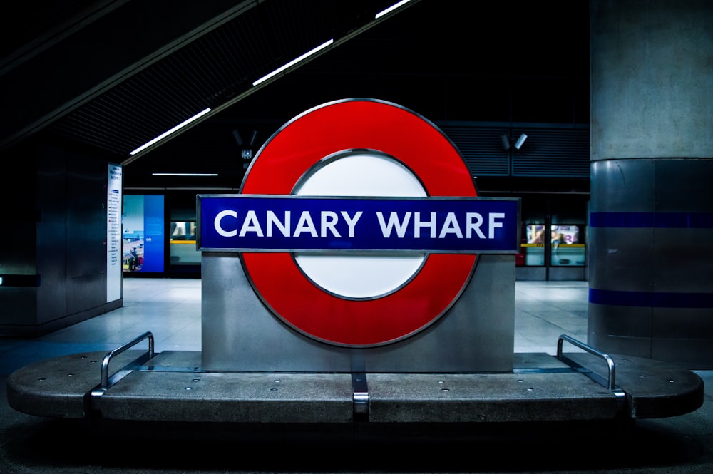 a sign that reads canary wharf on it