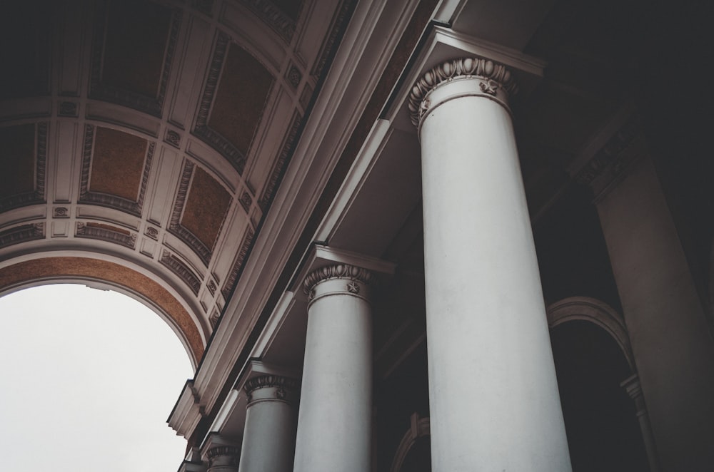 a couple of white pillars in front of a building