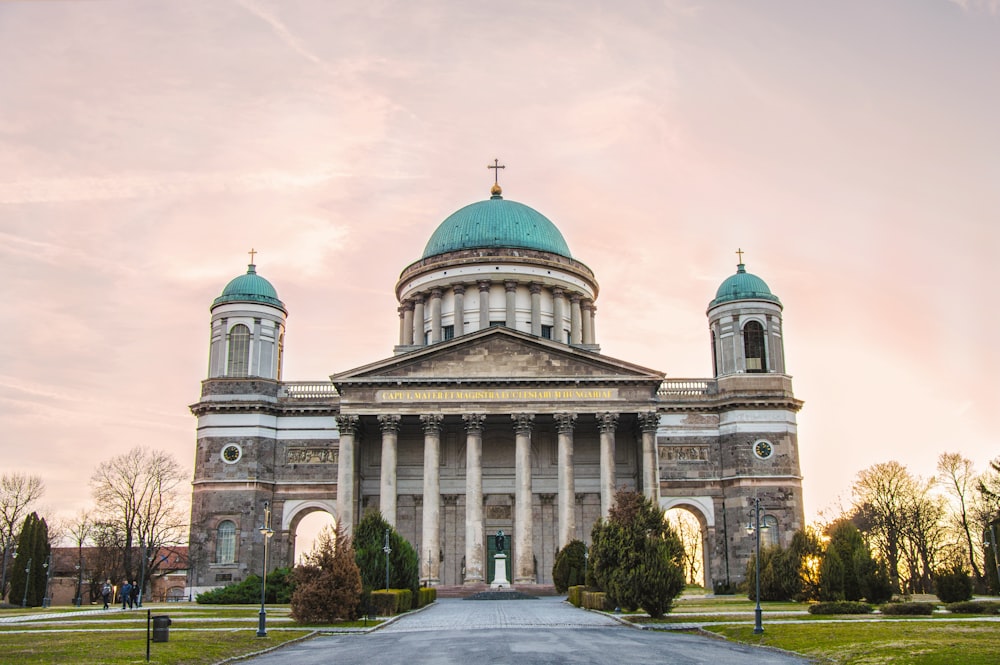 a large building with a green dome on top of it