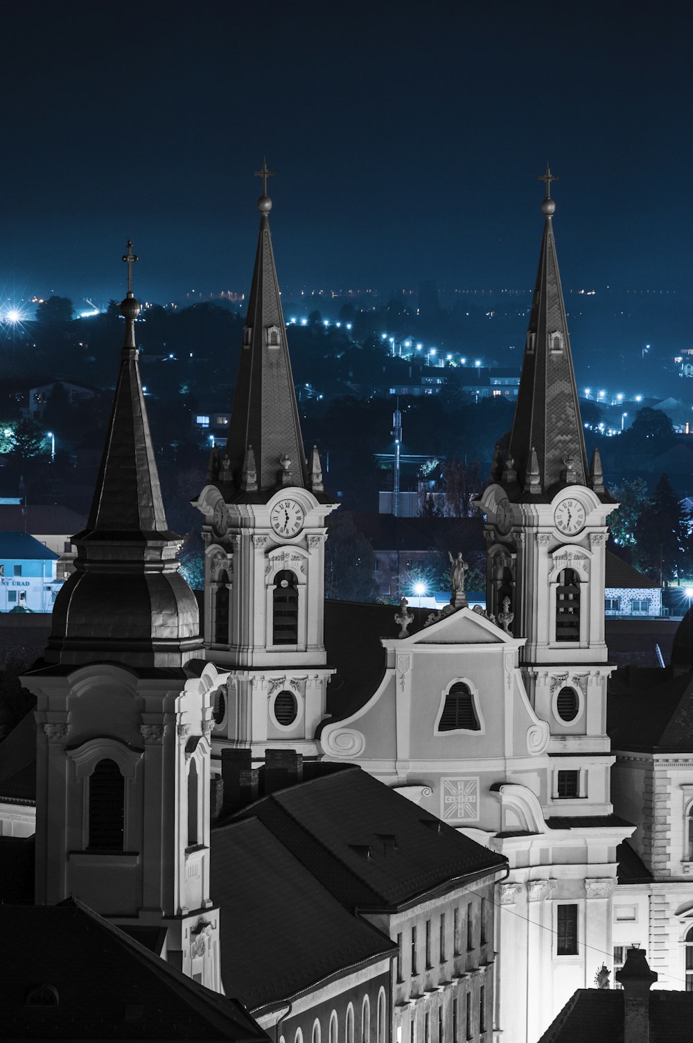 a black and white photo of a city at night