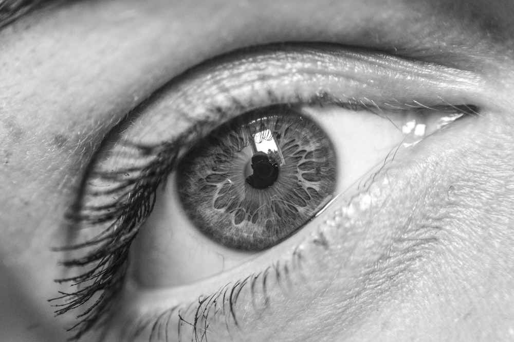 a close up of a person's eye with long lashes