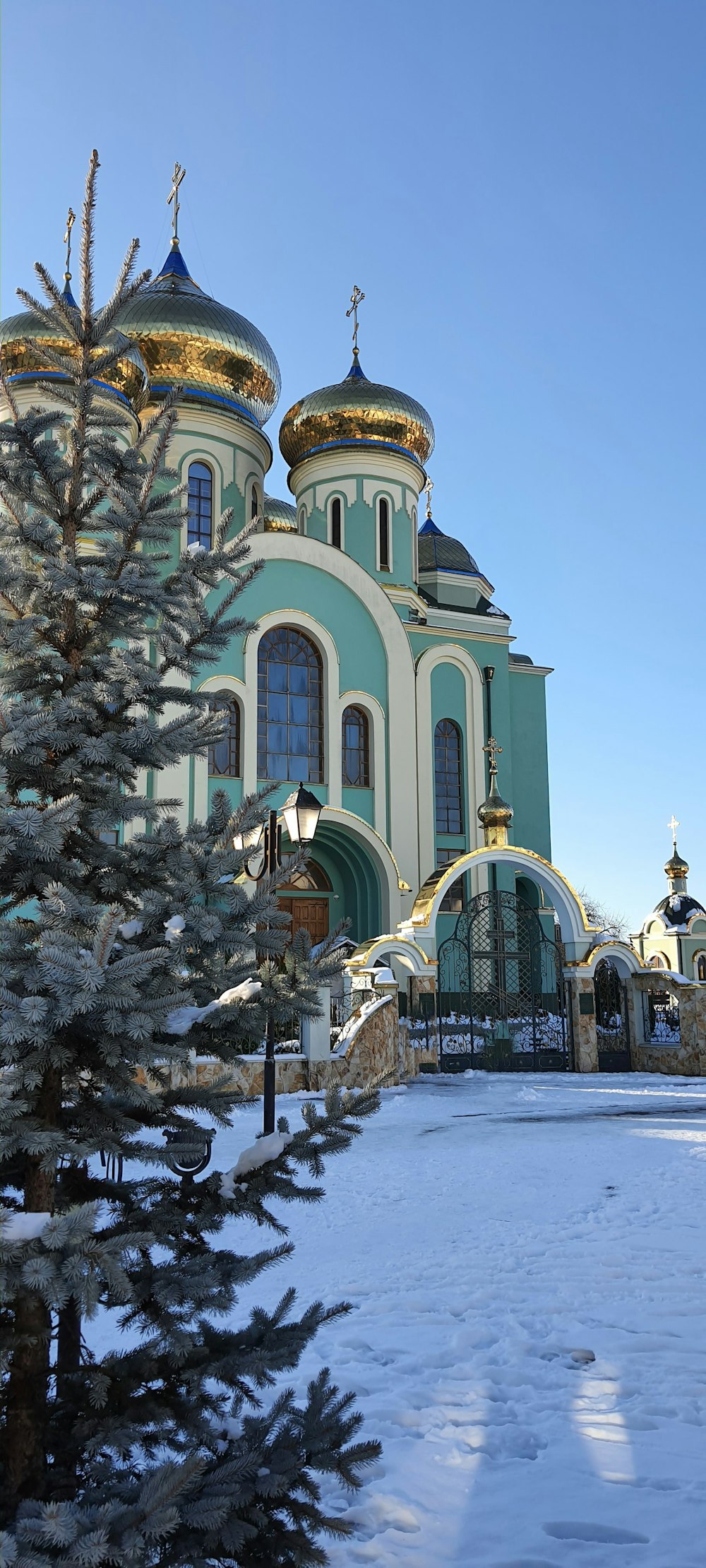 a church with a large green and white building