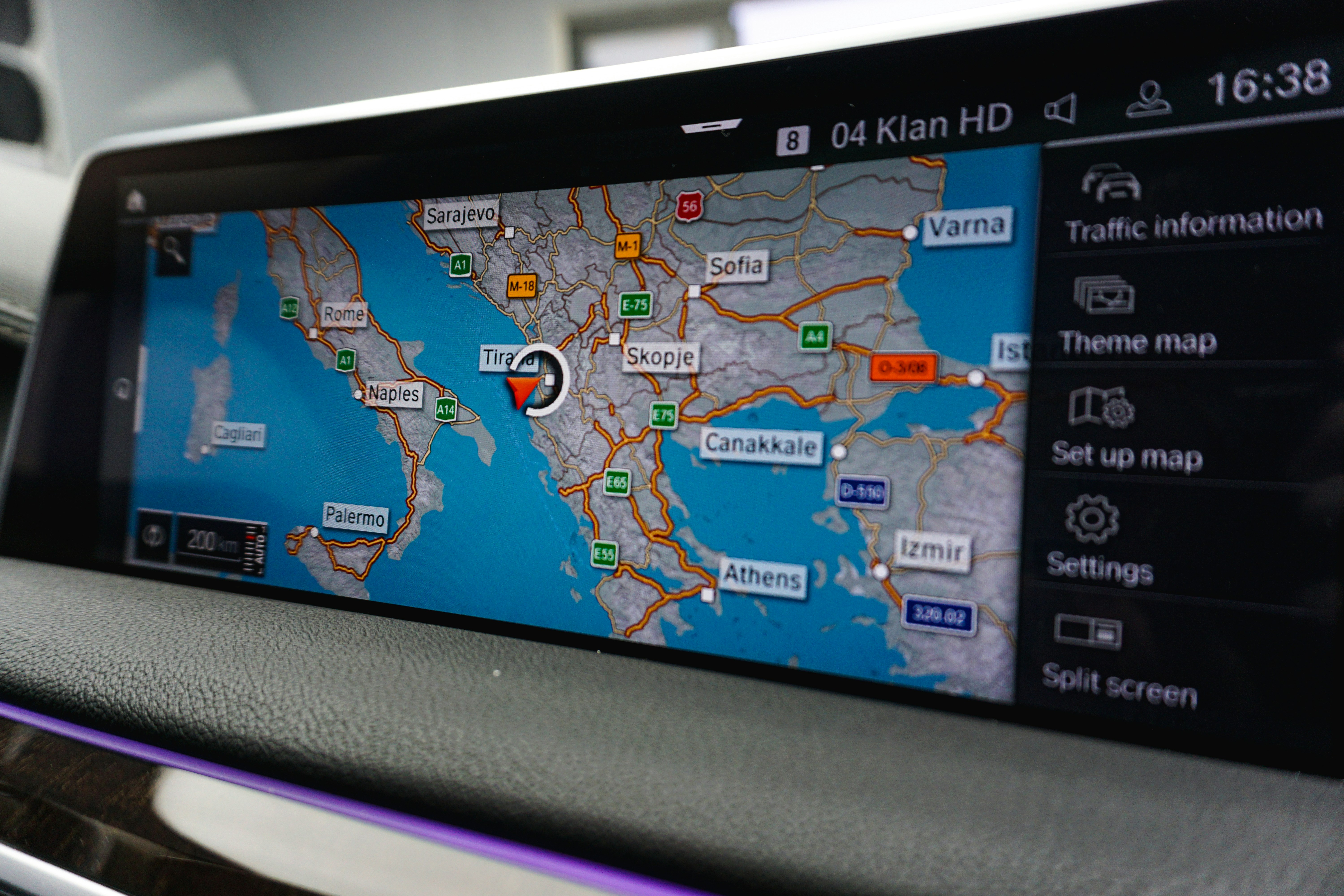 Tesla Model 3 interior showing large central touchscreen displaying energy and navigation data