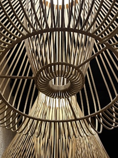 Handcrafted wooden wind spinner with intricate patterns inspired by Greek island architecture.