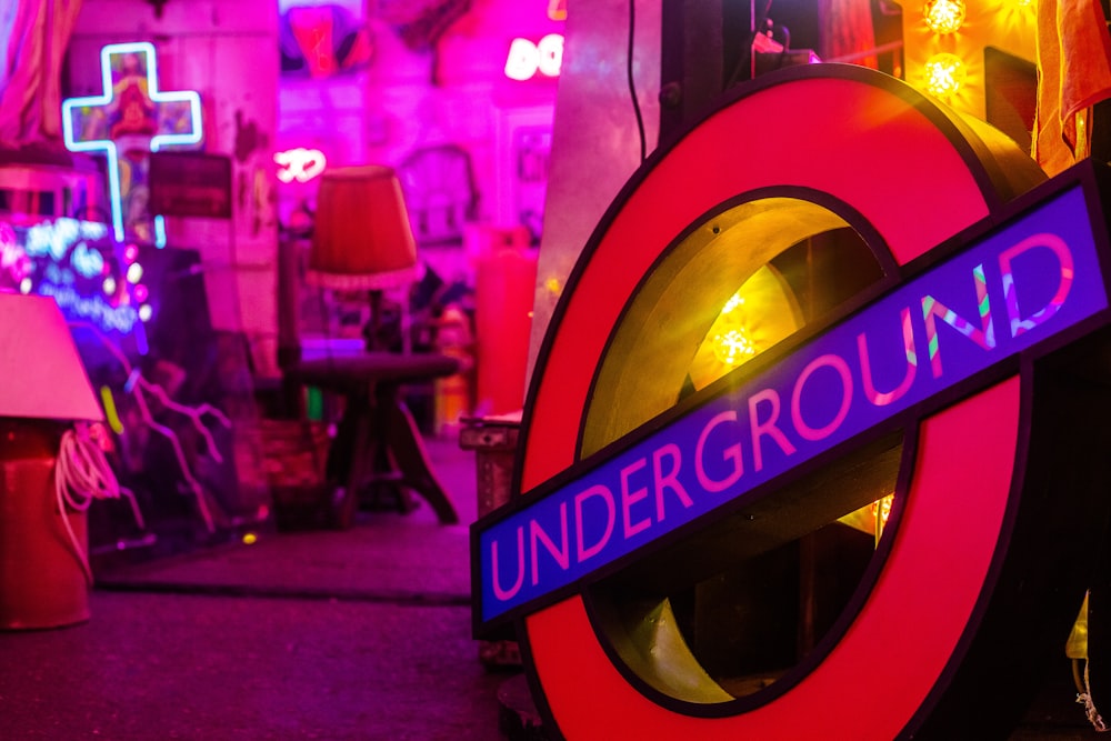 a neon underground sign in a dark room