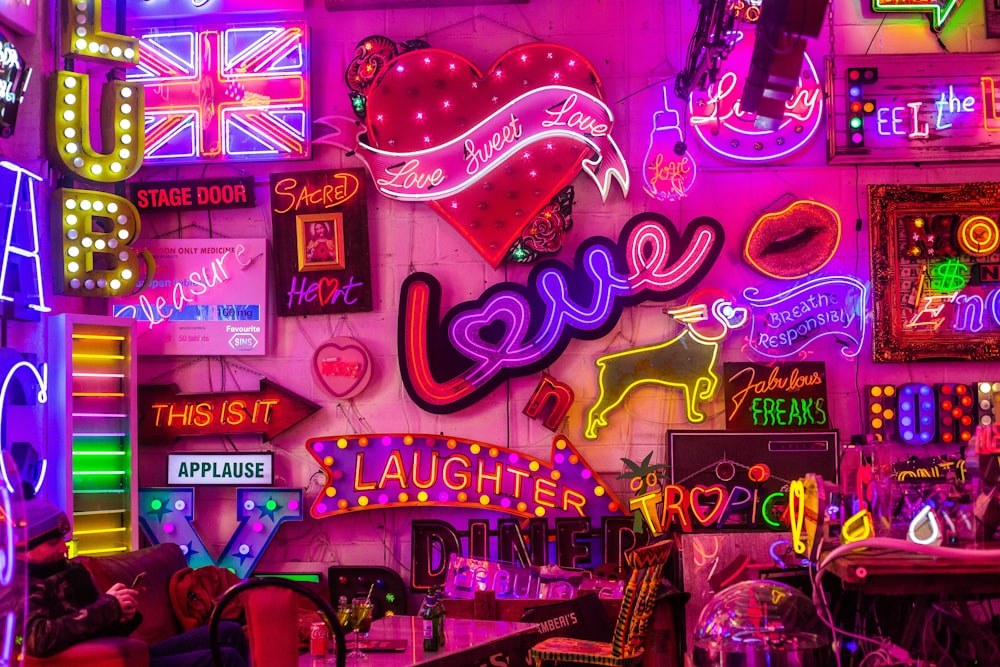 a room filled with neon signs and neon lights