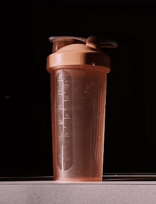 a blender bottle sitting on top of a counter