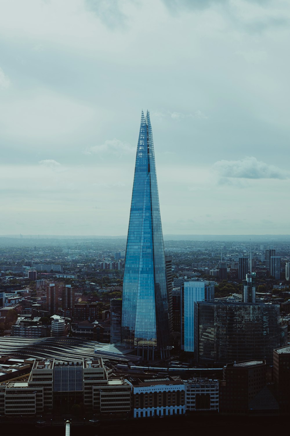 a very tall building towering over a city