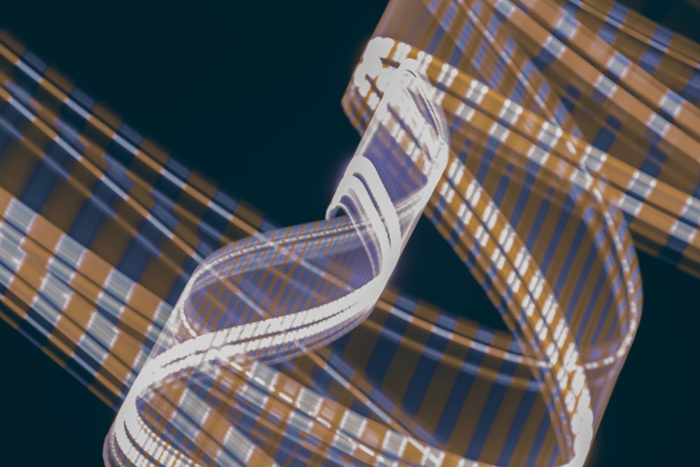 a 3d image of a double strand of white and brown striped ribbon