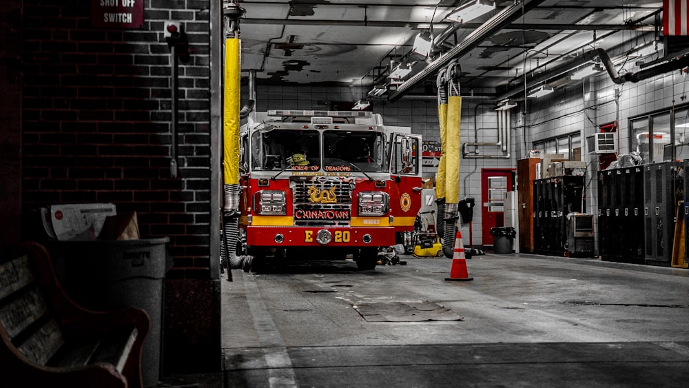 a fire truck parked inside of a garage