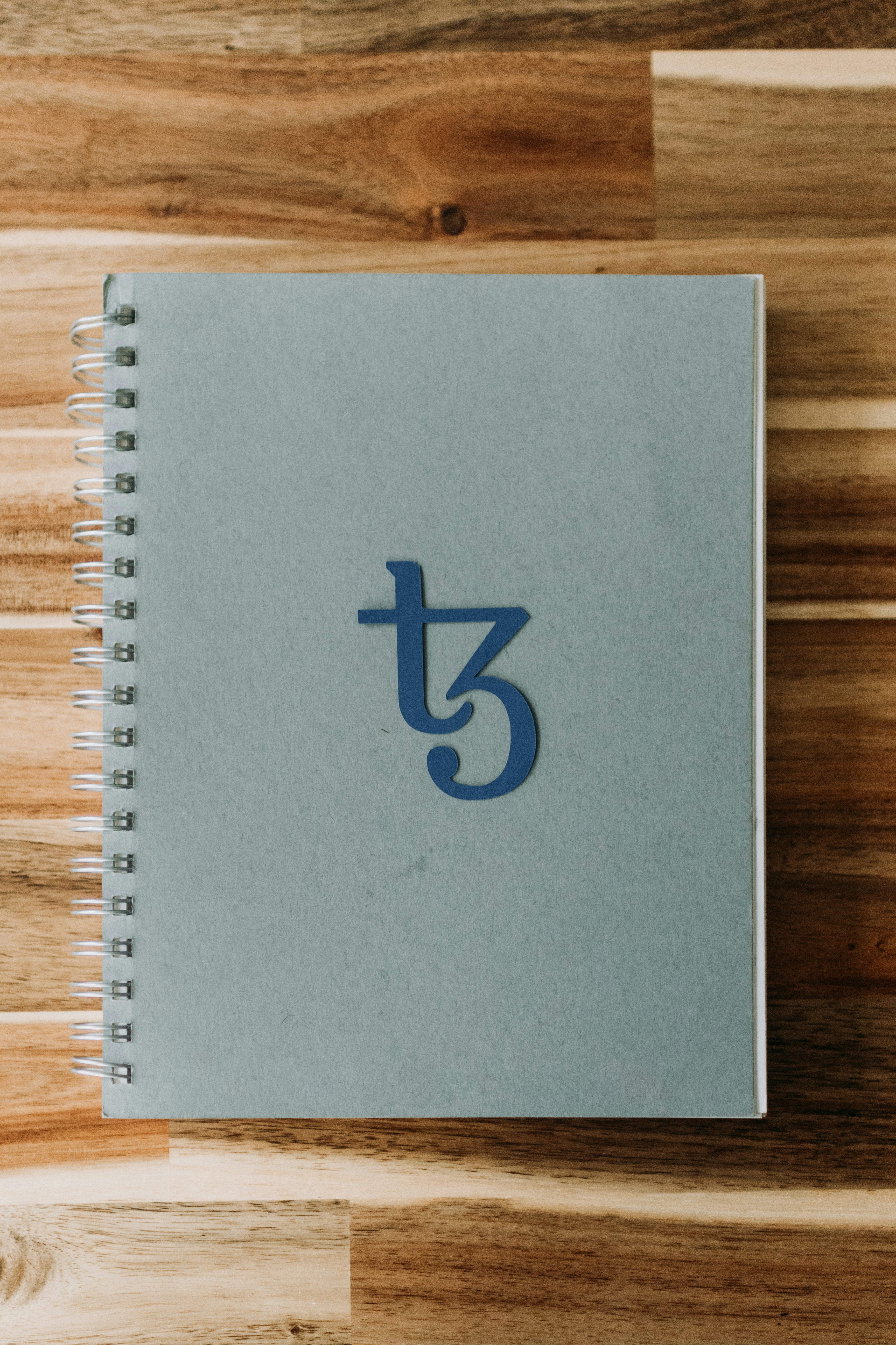 Tezos logo on a notebook