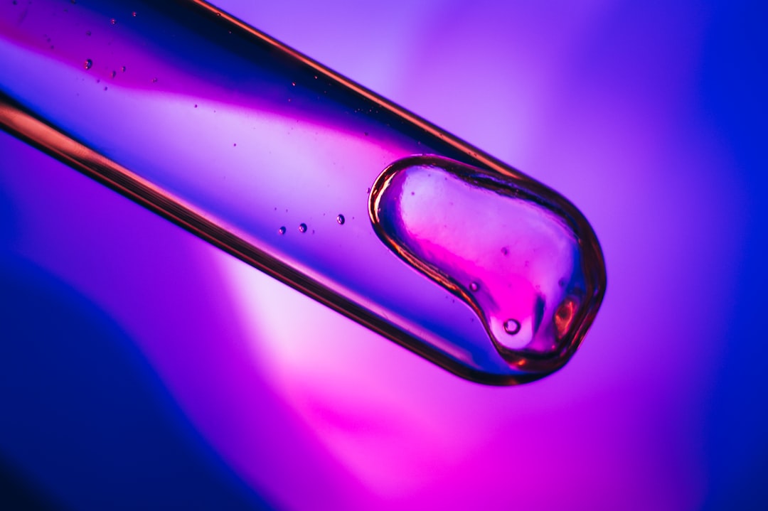 a close up of a purple and blue liquid,