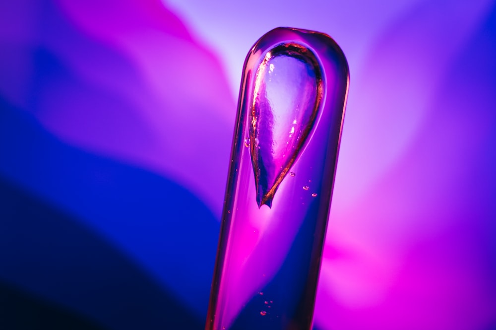 a close up of a purple and blue vase