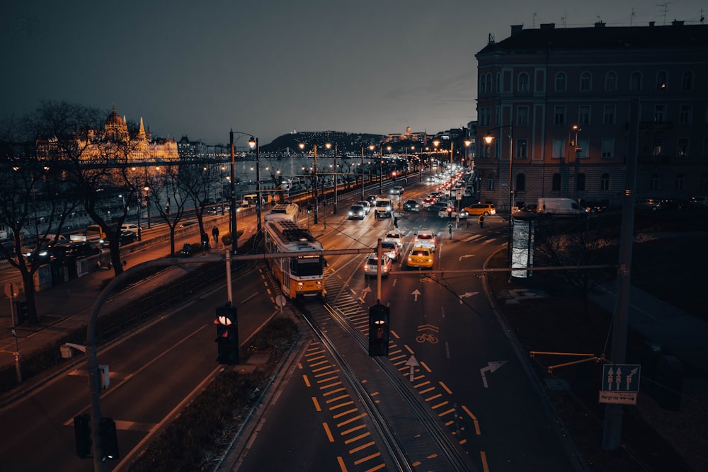 a city street filled with lots of traffic at night