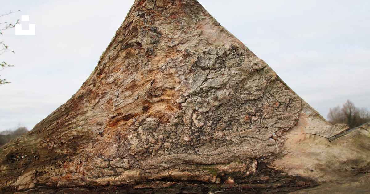 A very large rock with a very large triangular shape photo – Free ...