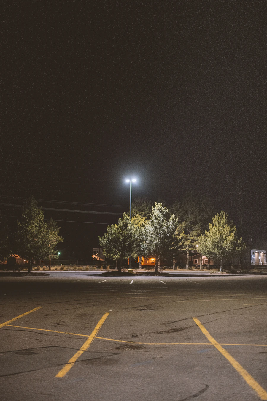 Commercial parking lot pole lighting at night in South Florida