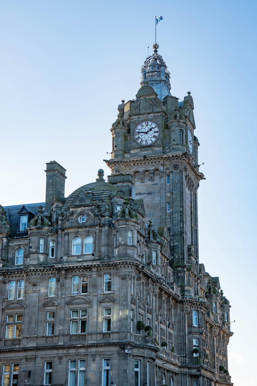 a large building with a clock on the top of it