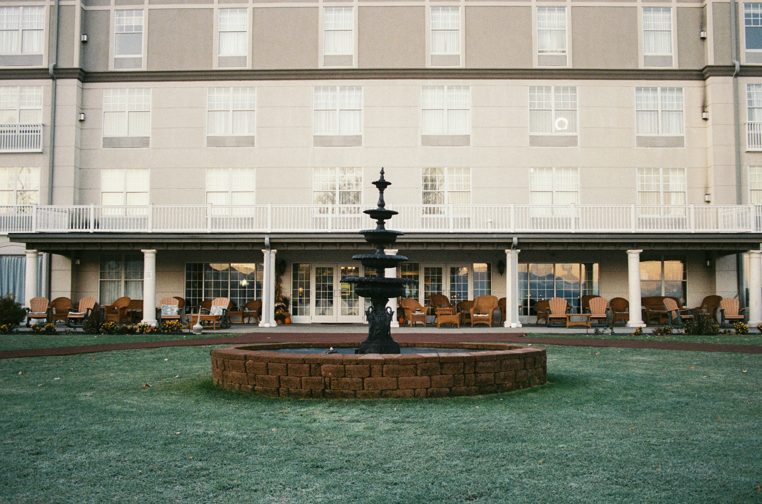 a large building with a fountain in front of it
