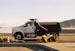 a dump truck parked on the side of the road