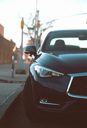 a close up of a car parked on the side of the road