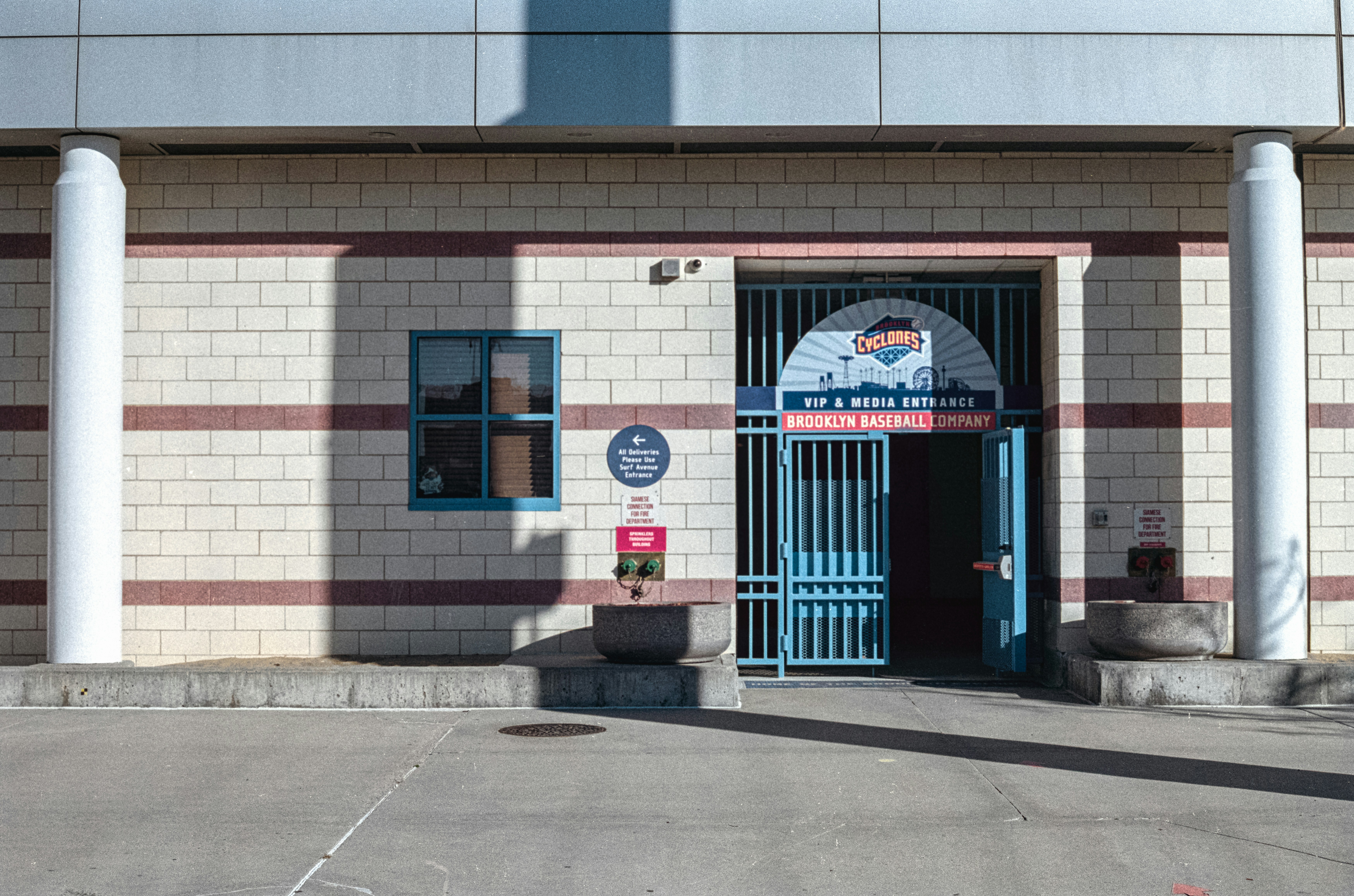a building with a blue door and a sign on the front of it