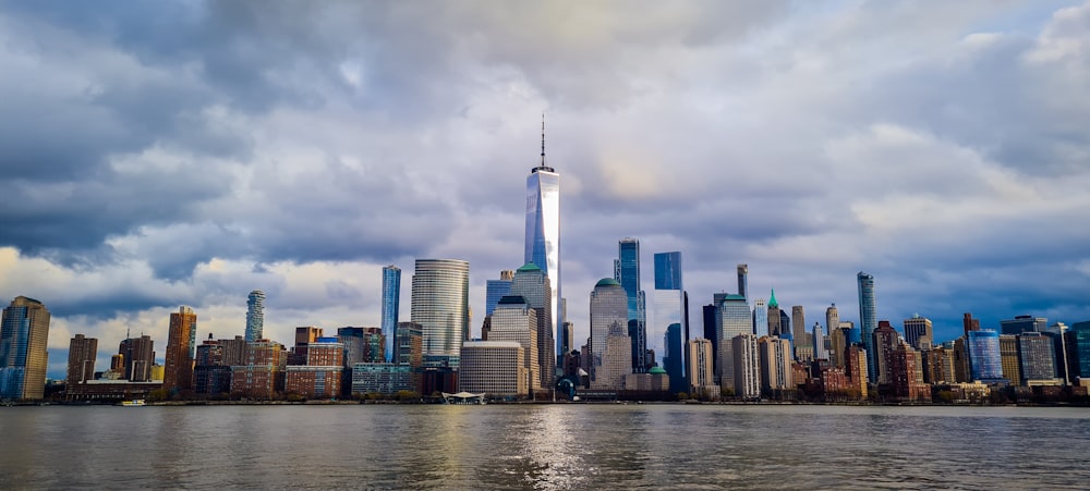 a large body of water with a city in the background