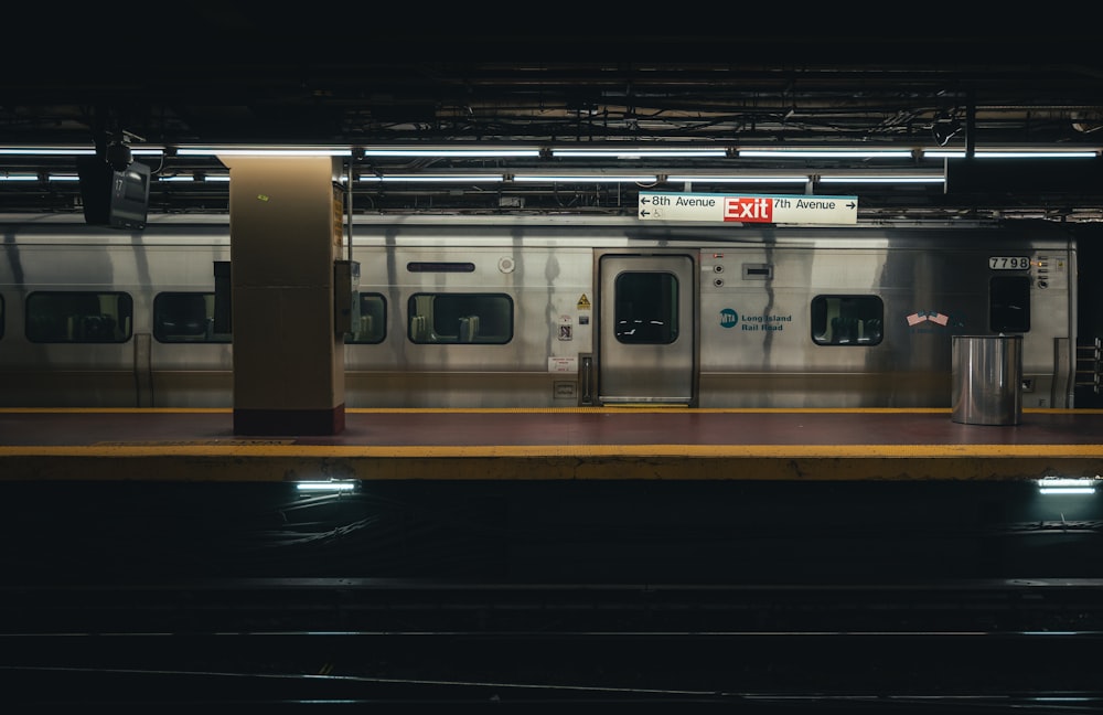 a subway train is stopped at a station