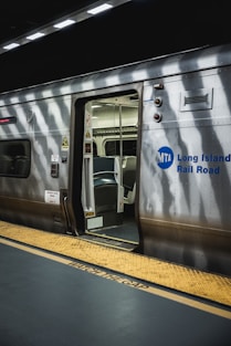 a train with its doors open at night