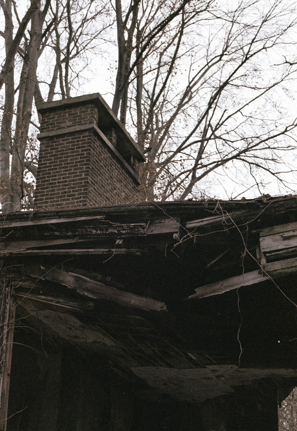 a brick chimney on top of an old building