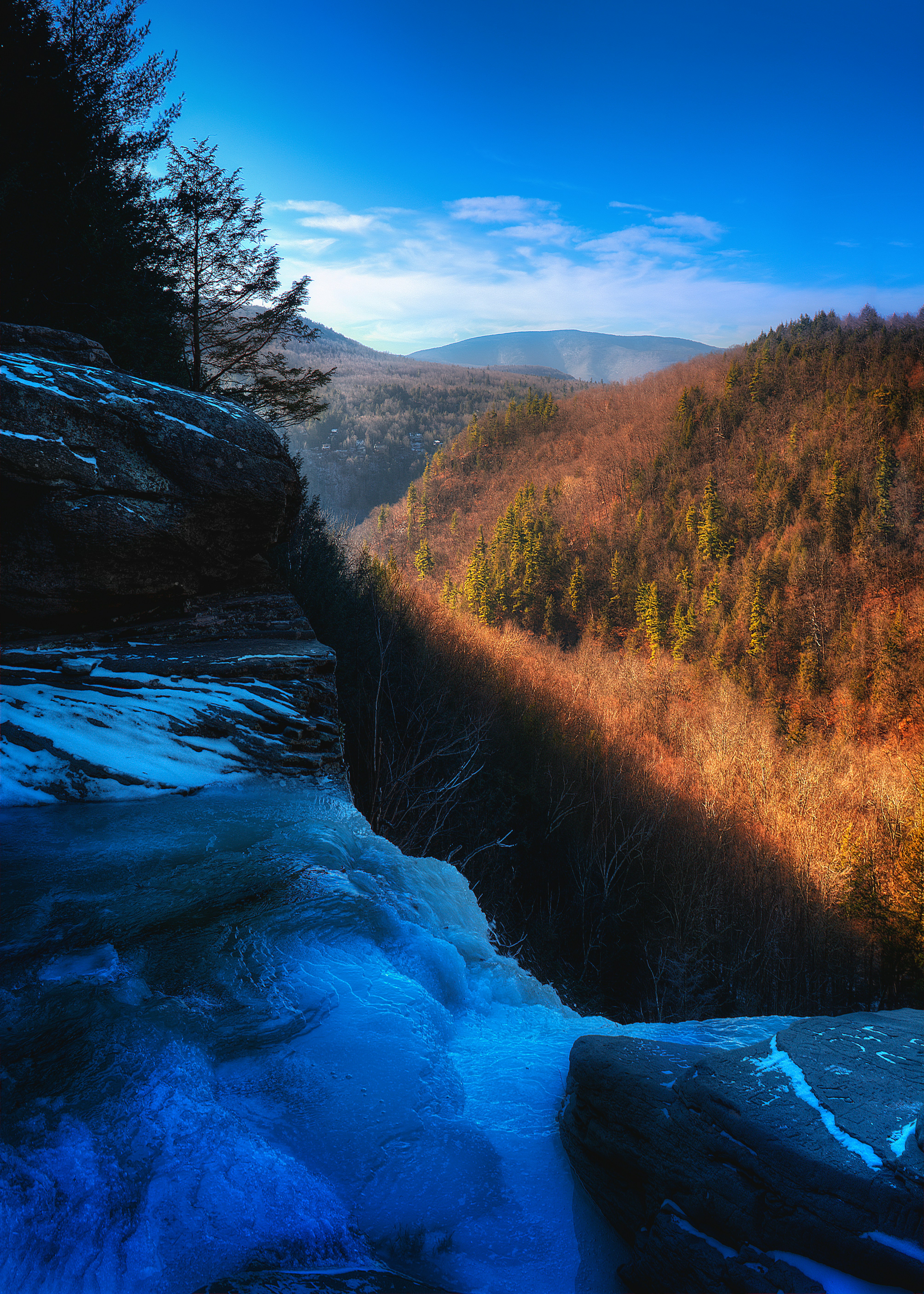 a scenic view of a mountain with a river running through it