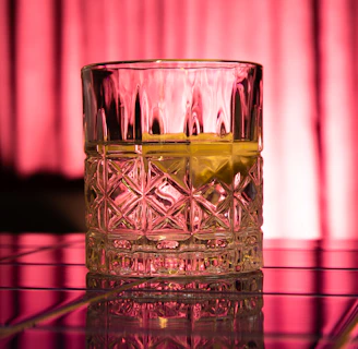 Close-up of swirling whiskey in a crystal glass with soft background lighting