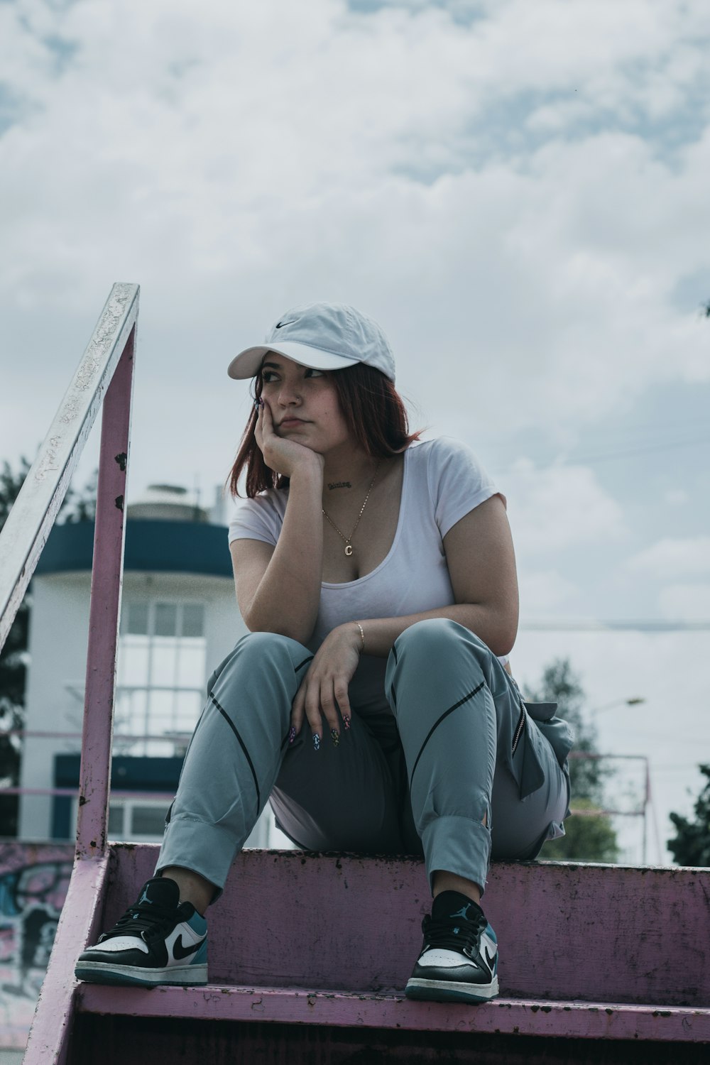 a woman sitting on the back of a truck