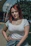 a woman with red hair is posing for a picture