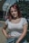 a woman with red hair is posing for a picture