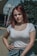 a woman with red hair is posing for a picture