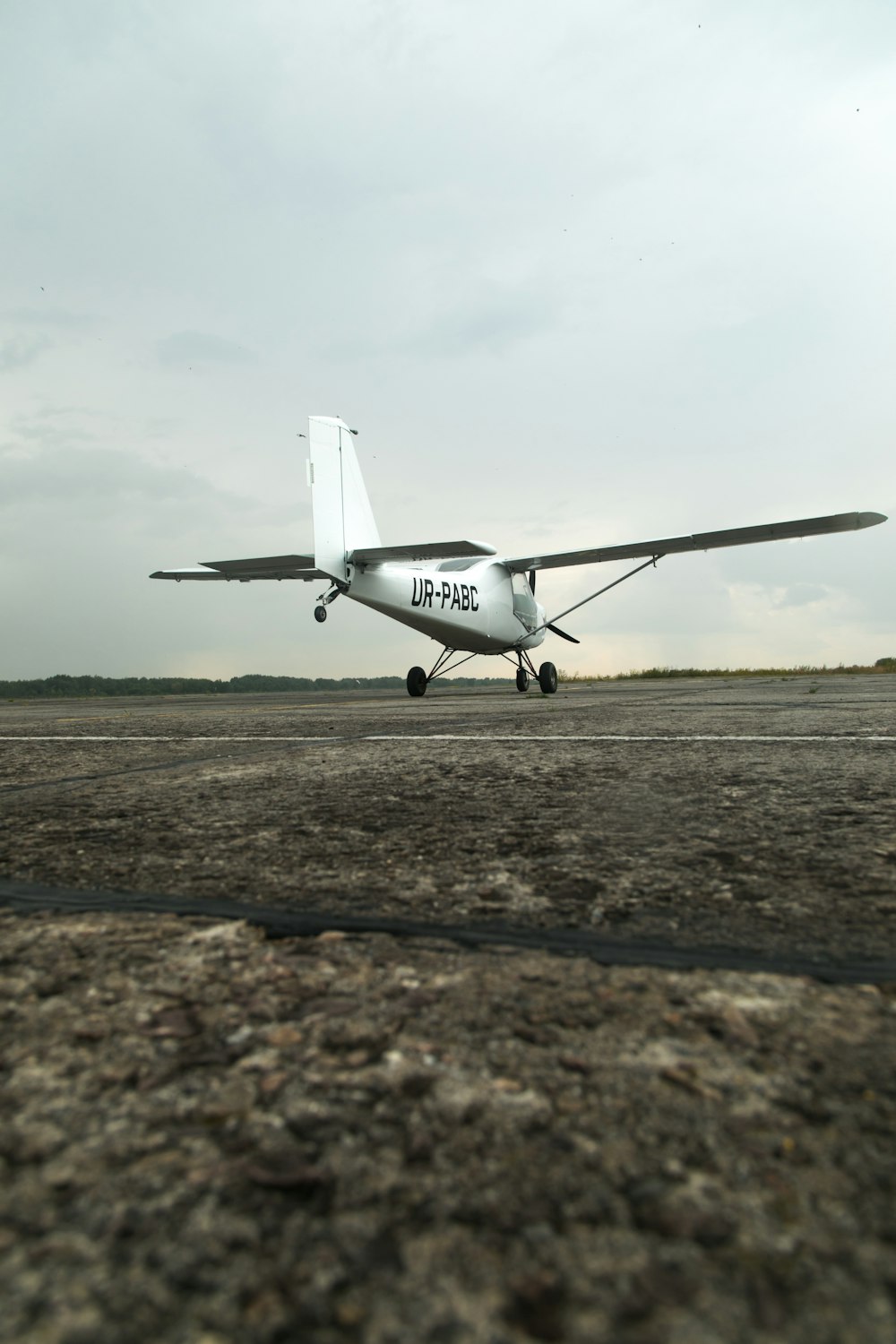 a small airplane sitting on top of an airport runway