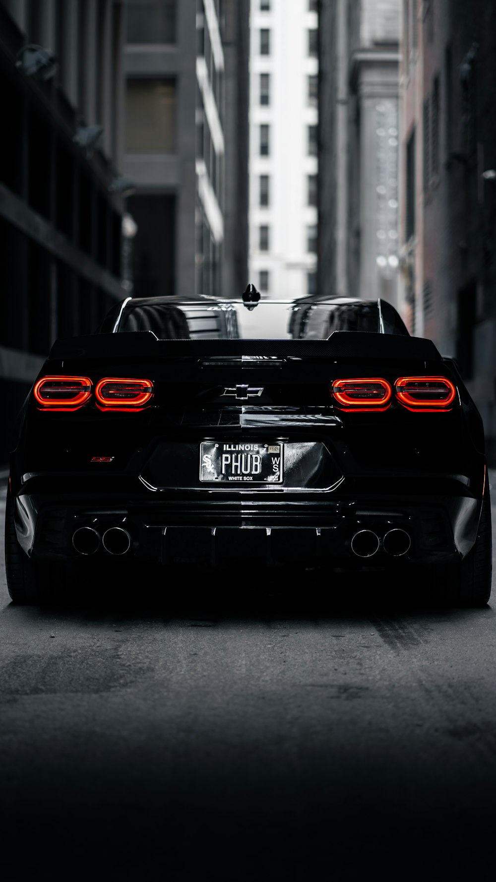 a black sports car parked on a city street