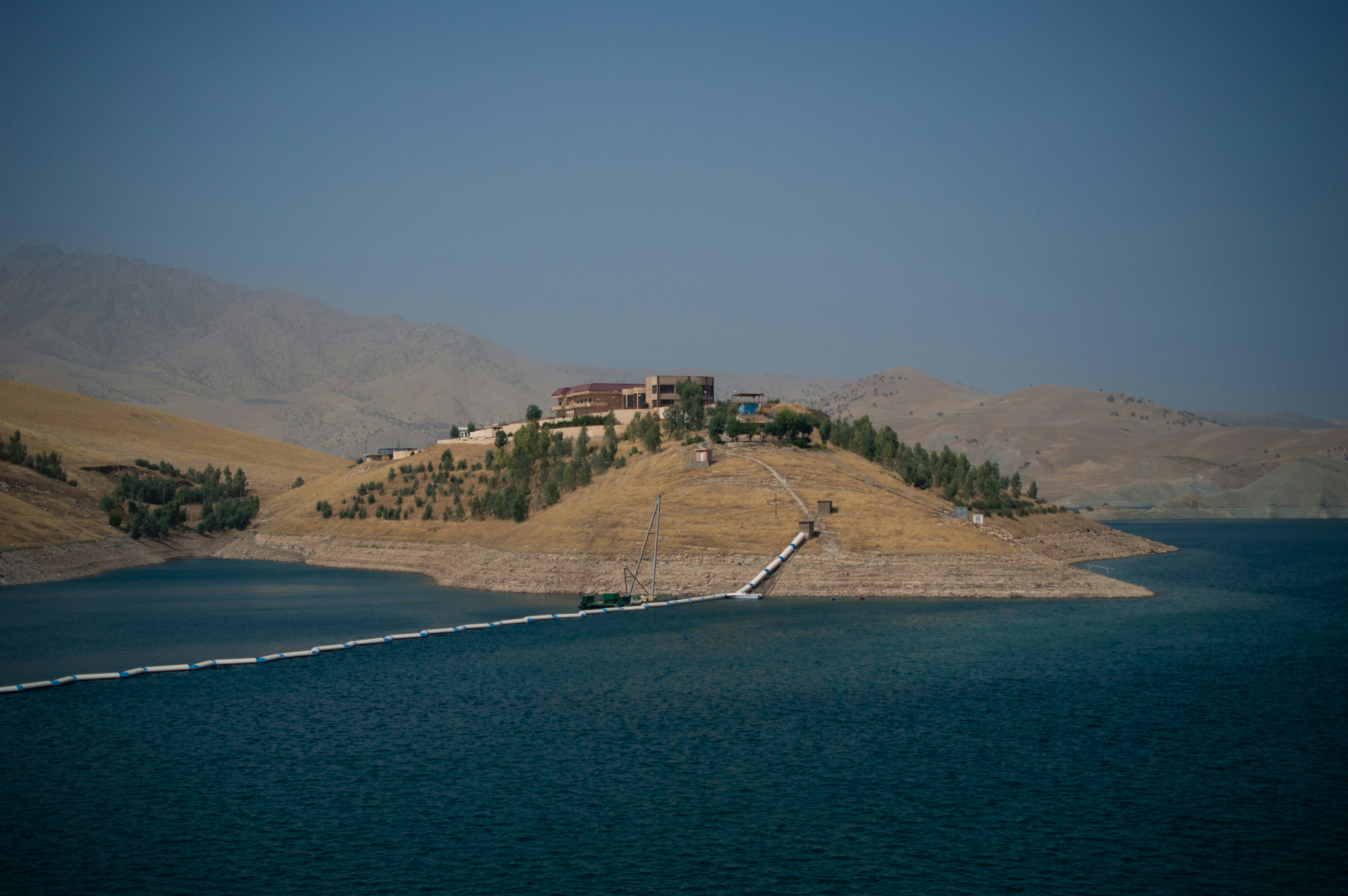 a large body of water with a house on top of it