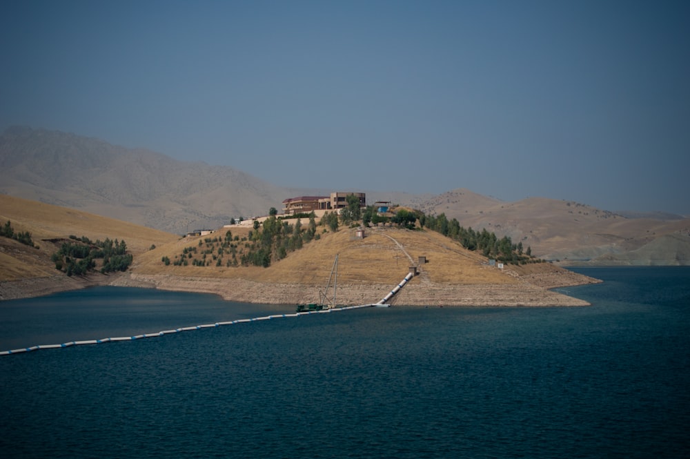 a large body of water with a house on top of it
