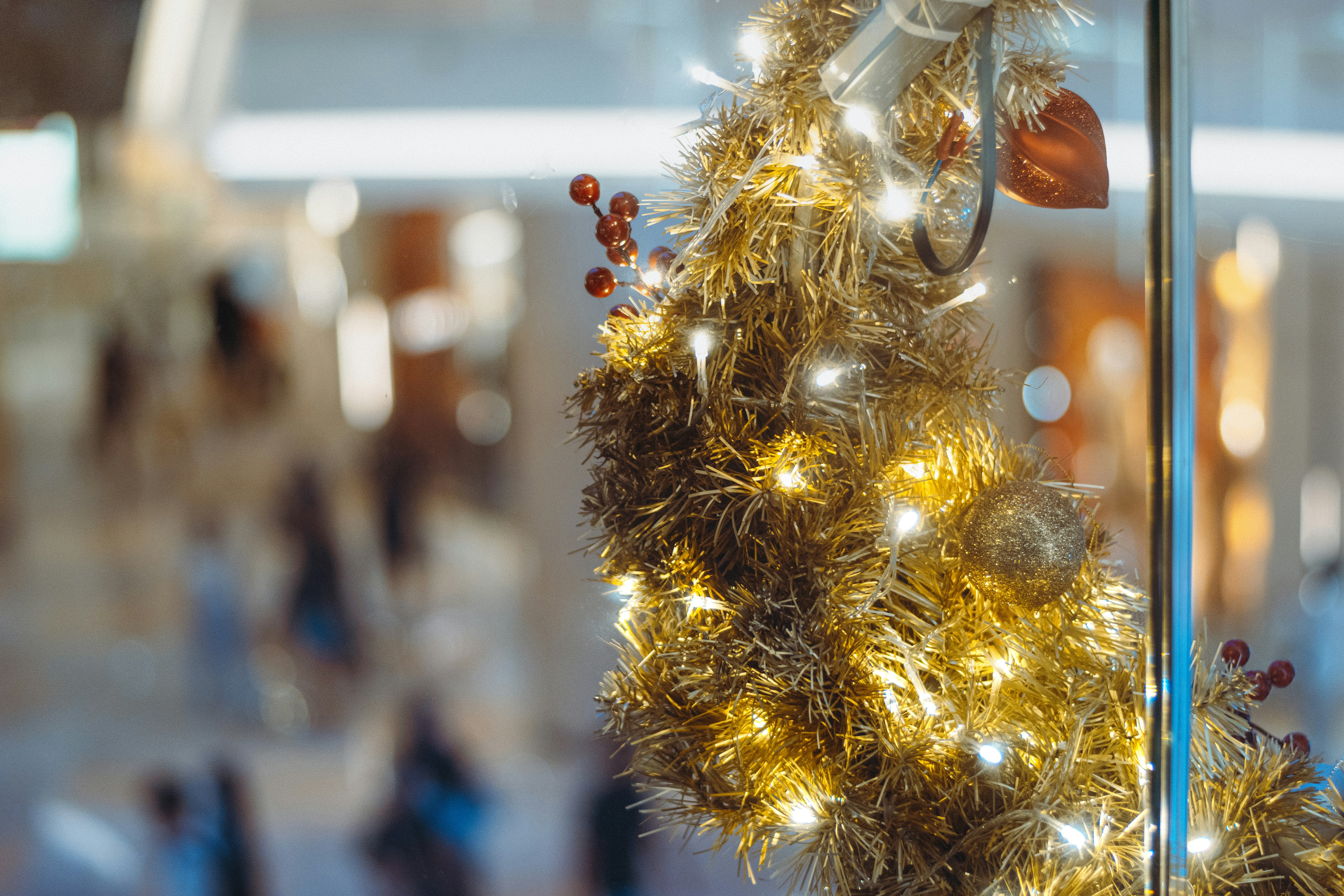 a close up of a christmas tree in a store window