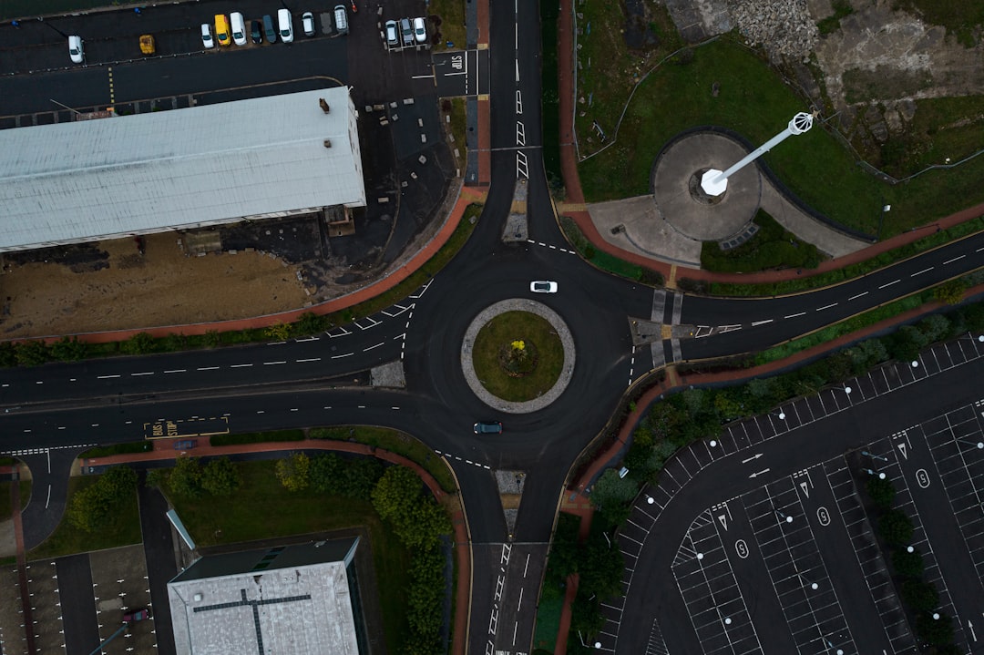 an aerial view of a city intersection with a clock tower