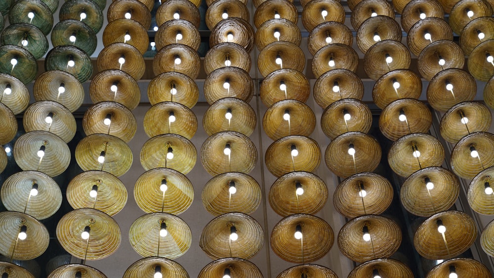 a large number of round lights hanging from the ceiling