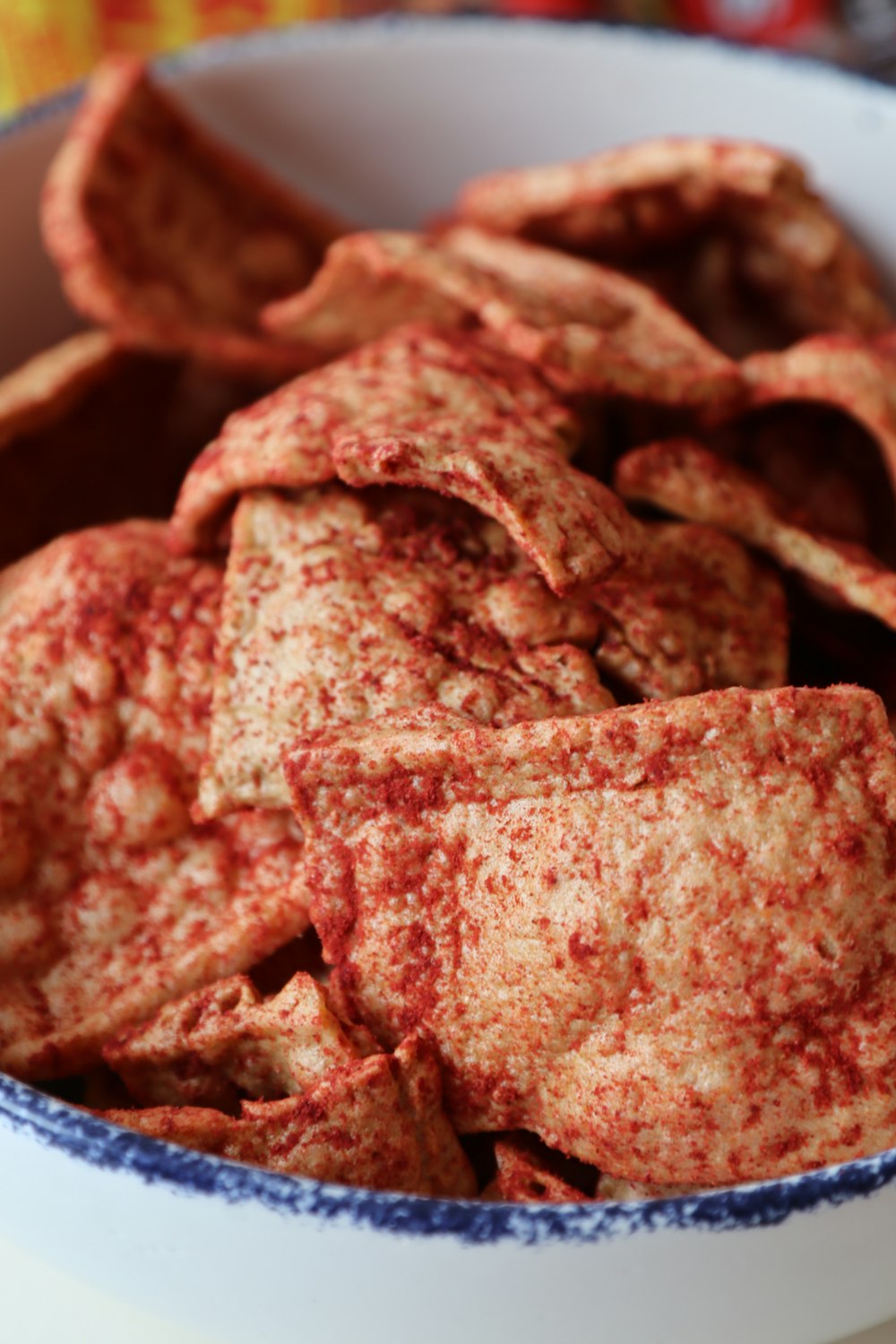 a bowl full of crackers sitting on a table