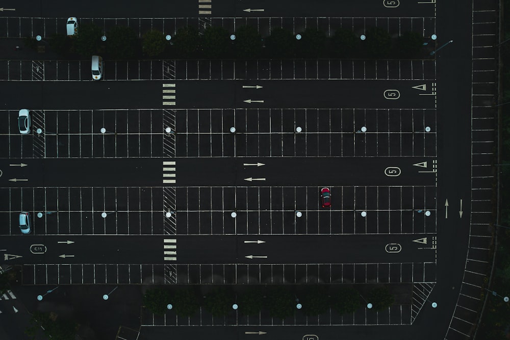 an overhead view of a parking lot at night