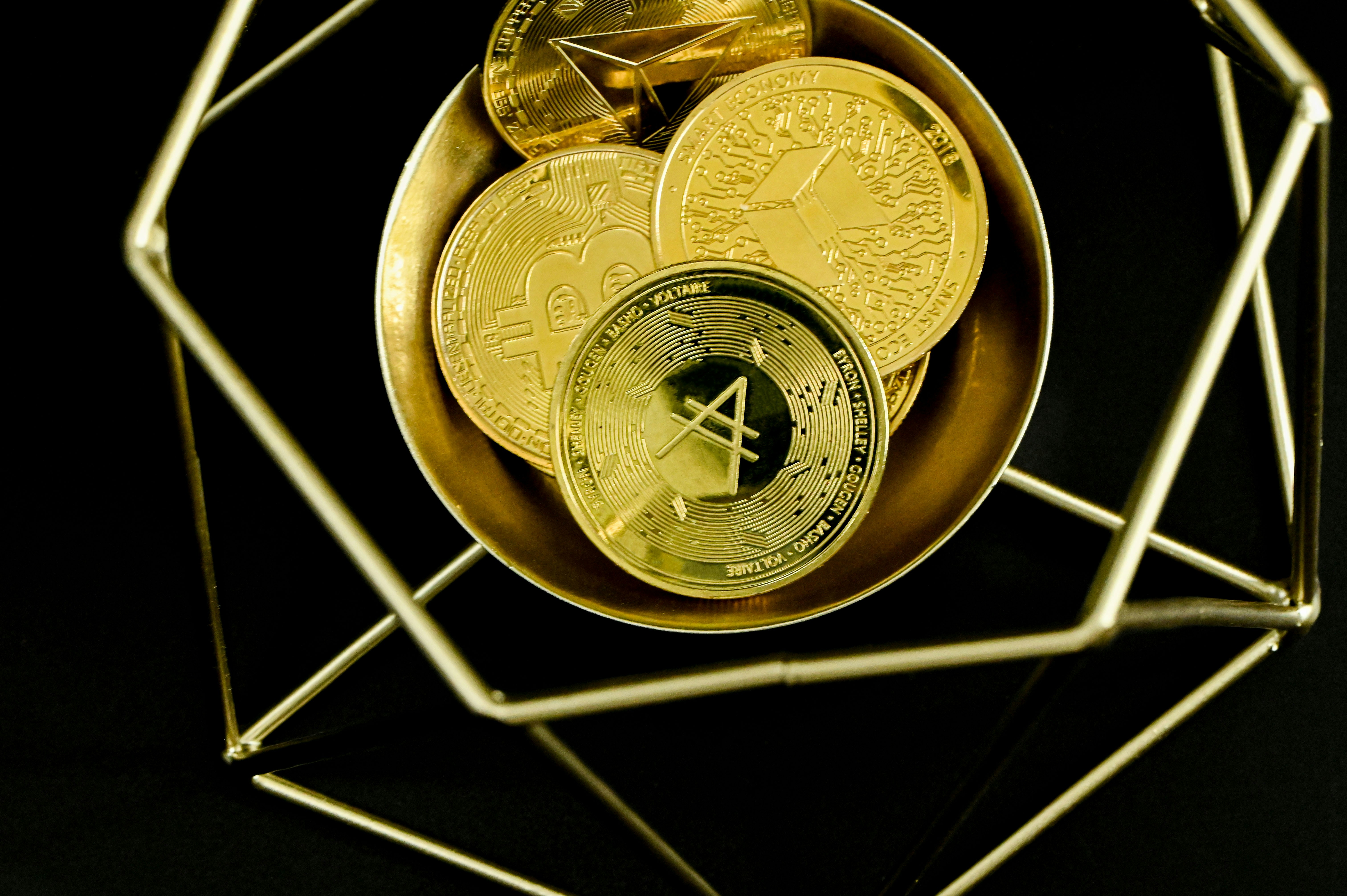 A group of cryptocurrencies in a golden cage