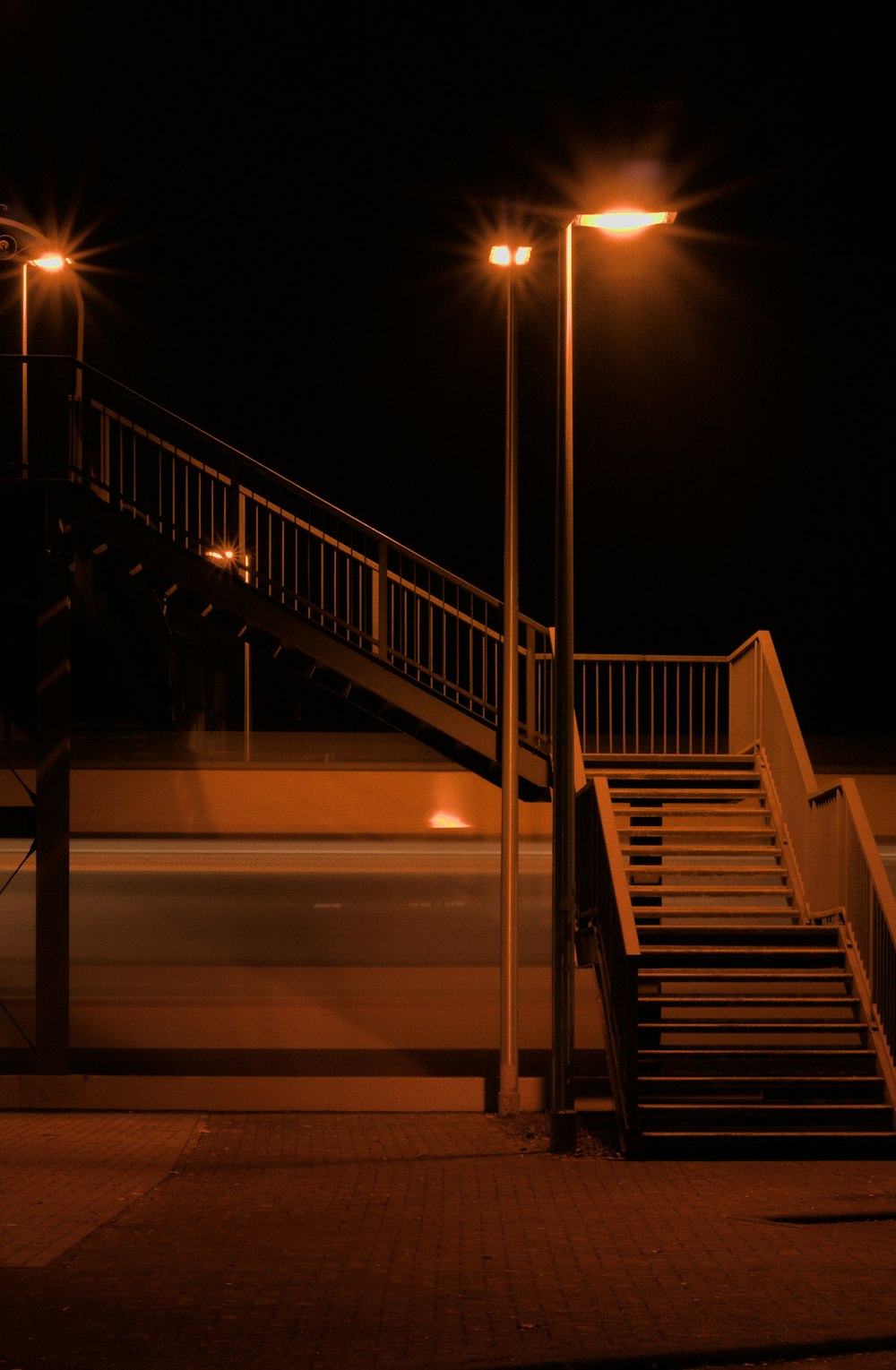 a set of stairs leading up to a street light