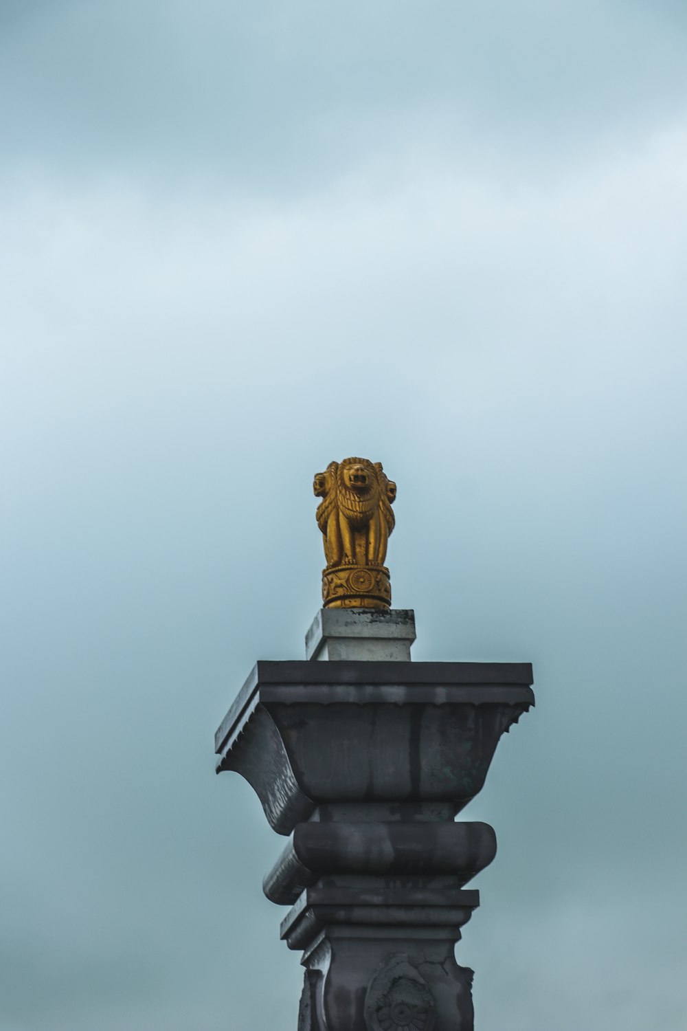 a statue of a lion on top of a building