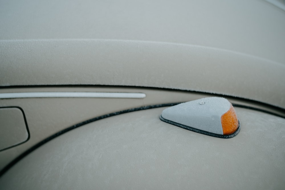 a close up of a button on a car