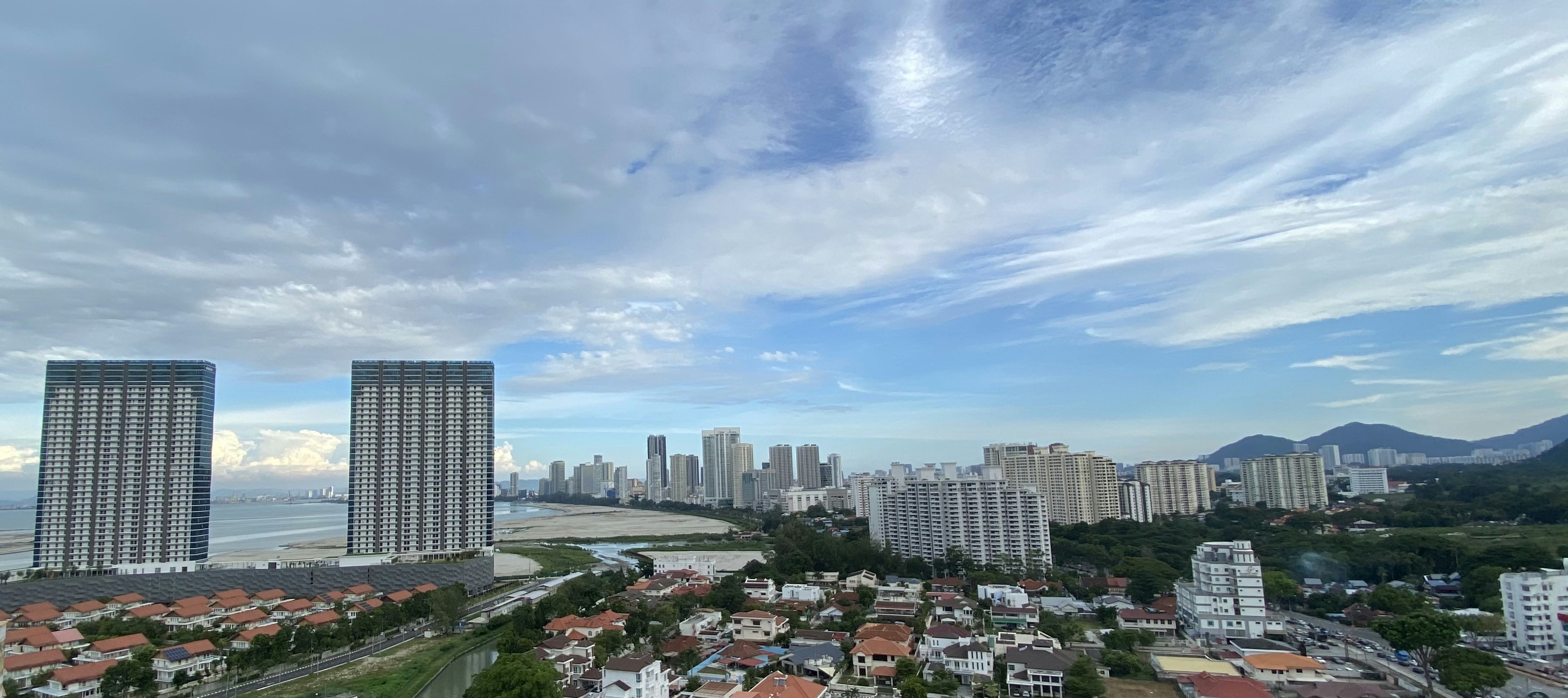 an aerial view of a city with tall buildings